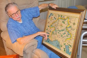 Camas resident George Willis, a World War II veteran, points out the places where the 42nd Infantry Division, known as the "Rainbow Division" battled to defeat Nazi Germany. The map was created shortly after the war.