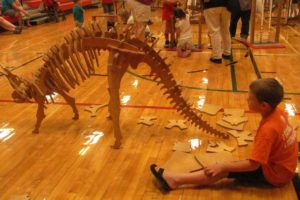 Constructing a dinosaur skeleton was just one of the many hands-on activities children could participate in during the  OMSI Science Festival at Hathaway Elementary School on Wednesday.  More than 250 children and their caregivers came out to the last free summer event at the school, which was one of five held during July and August.