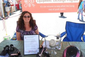 Julia Ross, director of the Clark County Equipment Exchange Program, accepted donations of sports equipment twice this summer at the Camas Farmer's Market. Ross founded the program to promote participation in youth sports programs and leagues by helping families offset the costs of purchasing new equipment. When young athletes outgrow equipment such as soccer cleats, they can exchange them for a larger size. Donors are also invited to bring sports equipment sitting unused in their garages.