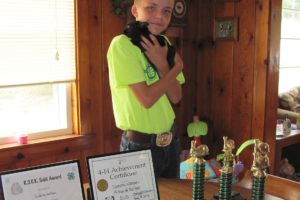 Dakota Watson of Camas holds his Polish rabbit, Prince. He has been active in the Washougal-based 4-H R.O.C.K.S club for four years, and has won several awards.