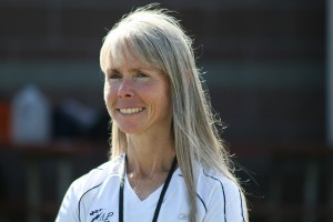 New Camas High School cross country coach Laurie Porter gets excited as she watches the Papermakers practice Monday.