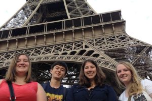 WHS students, from left, Kaycee Zieman, Robby Wayper, Jenni Ladwig and Alex Carstens, pose in front of  France's iconic landmark, the Eiffel Tower, during an eight day trip to France this summer.