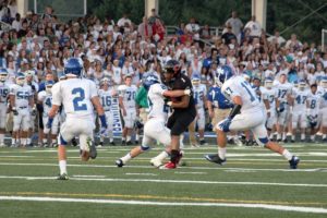 Jonathan Warner (1) bowls into a Mountain View defender Friday, at Doc Harris Stadium in Camas. Warner snagged 10 catches for 131 yards receiving and two touchdowns to help the Papermakers beat the Thunder 31-0.