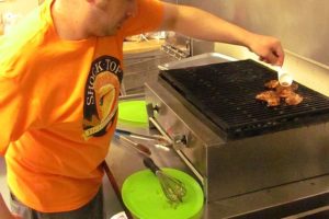 Andy Morones prepares teriyaki chicken at Local Girls Hawaiian Shave Ice & Grill. The former food cart business, in Portland, opened in the One Stop Shopping Center, in Camas, in August.