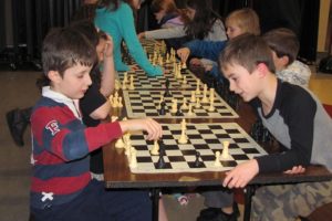 Community education programs in Camas and Washougal offer classes and activities for all age levels. Here, elementary students learn how to play chess.