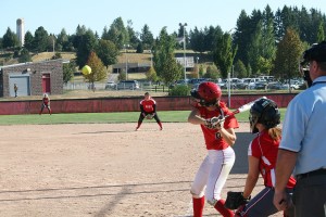 Rio Smith sits back on the slow pitch for the Papermakers Friday, at Camas High School.