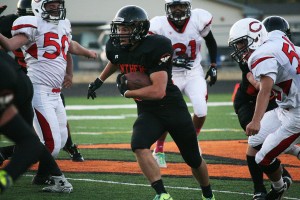 Garrett Duey gets loose on the football field at Fishback Stadium Friday. The WHS senior tied the score with an 18-yard touchdown run in the fourth quarter, but White Salmon won the game 14-7.