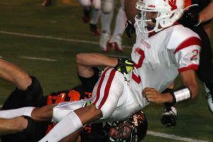 Bobby Jacobs traps the Fort Vancouver quarterback Friday, at Fishback Stadium. The Panthers shredded the Trappers 74-7.