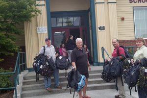 Members of the Camas-Washougal Rotary Club spent time distributing backpacks to children in need at area schools recently.