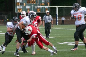 Stephen Camden escapes a trap set by Fort Vancouver Friday, at Kiggins Bowl. The Washougal senior blocked a punt and scored a touchdown.