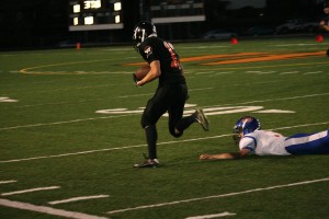 Brandon Casteel avoids Ridgefield's last defender and takes off on a 98-yard touchdown run for Washougal Friday, at Fishback Stadium. The Panthers defeated the Spudders 26-14.