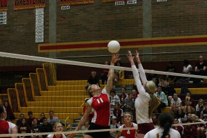 Camas middle blocker Carly Banks gets her fingertips on the volleyball. The visiting Papermakers blew the Prairie Falcons out of their own building 25-21, 25-27, 25-12, 25-9.