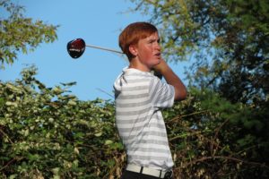 Brian Humphreys watches his golf ball land on the sixth green Thursday, at Camas Meadows. The sophomore shot an even par round of 36 strokes to help the Papermakers beat Union 149-155.