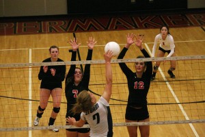 Camas volleyball players Molly McPhun and Sophi Jacobson defend the net against the Storm, while Christina Elliott and Abby Young provide backup. The Papermakers defeated Skyview 25-19, 24-26, 25-19, 25-11 Sept. 23, at Camas High School.