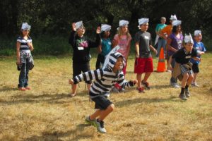 Fourth-grade students run through a salmon obstacle course on Friday as a part of the Columbia River Watershed Festival at Capt. William Clark Park.