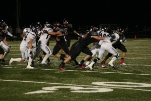 The Camas offensive line pushes Skyview in both directions Friday, at Doc Harris Stadium. The Papermakers reigned 42-17.