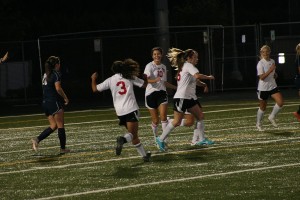 Anyssa DeVera runs up to hug Emily Ponce after the two Papermakers connected on the first goal of the game against Skyview Sept. 25, at Doc Harris Stadium.