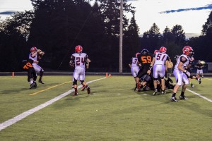 Washougal defensive lineman Caleb Economides blind sides R.A. Long quarterback Ryan Peerboom in the end zone to give the Panthers two points on a safety. The Lumberjacks escaped Fishback Stadium with a 34-31 victory.