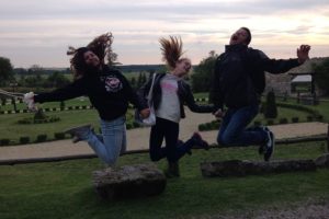 Abigail Engel and Carson Dunn share a fun moment with a Polish student during the English Language Camp in July. The trip also included tours and events in addition to teaching students and teachers conversational English.