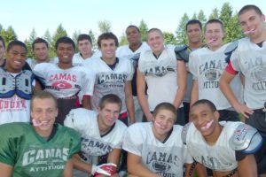 Camas High School football players show of their pink mouthguards, which were designed by Franson Family Dentistry of downtown Camas.