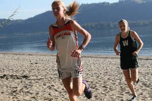 Courtney Owens looks confident after taking the lead on Cottonwood Beach Wednesday, in Washougal. The Panther crossed the finish line with a new course record time of 21 minutes, 19 seconds.