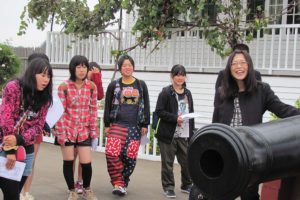 One of the activities the Taki delegation participated in was a tour of historic Fort Vancouver. Here, they learn about the cannons outside Chief Factor's house.