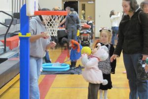 A youngster shoots hoops during the annual Family Halloween Night at Liberty Middle School. The event, sponsored by Camas Parks and Recreation, features a game area for children ages 5 and younger, as well as activities for older kids.