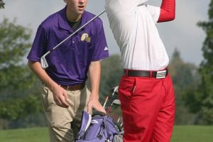 Daniel Patterson watches his tee shot land on the green during the 3A district tournament Wednesday, at the Tri-Mountain golf course in Ridgefield. The Camas High School senior won a playoff for fifth place.