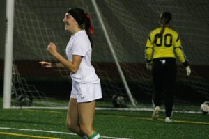 Haley Briggs pumps her fist after netting a golden goal for Washougal in double overtime Oct. 14, at Fishback Stadium. The Panthers defeated Woodland 2-1.