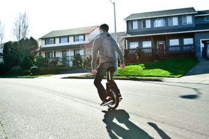 Andrew Wheeler demonstrates the use of a self balancing unicycle with an electronic motor brake, in a Camas neighborhood. The unicycle was created by Focus Designs, of Camas.