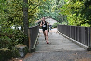 Alexa Efraimson crosses at the creek at Lewisville Park Thursday. The Camas High School sophomore won the 4A district girls championship race with a time of 18 minutes, 9 seconds.