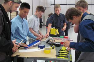 Ryan Burden (third from left, clockwise), a senior at Washougal High School, works with other students at the Clark County Skills Center aviation program. Burden wants to be a pilot and is hoping this program helps prepare him for the future.