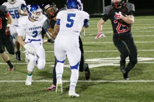 Cole Zarcone gets a block from James Price and continues running down the field for the Papermakers Friday, at Doc Harris Stadium.