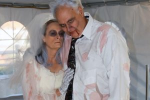 "Zombie bride and groom," Linda and Mike Harnish enjoy the festivities during a performance at Camas Meadows.