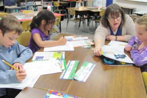 Cape Horn-Skye Elementary has been named a Washington State School of Distinction for its performance on state tests. Principal Mary Lou Woody credits the teachers and strong parent community for the school's success. Here, third-grade teacher Lucie Willeman  works with students on reading comprehension.