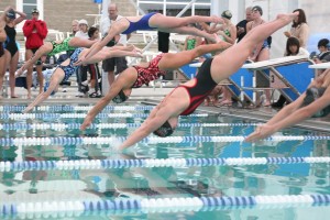 Anna Panebianco is the first one to hit the water. The freshman finished in first place in four events to help the Camas girls swimmers capture the district championship Saturday, at Kelso.