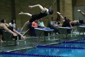 Juliann Reed dives into the swimming pool during the 4A district meet Saturday, at Kelso High School.