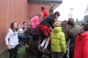 Liberty Middle School students climb on the anchor which was once a part of the SS Davy Crockett, a World War II Liberty ship. "It's a community art piece," principal Marilyn Boerke said. "You can climb on it."