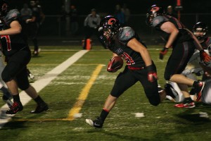 Vince Huber gallops to the end zone for one of his four touchdowns Saturday, at Doc Harris Stadium. The Camas football team battered Arlington 62-6.