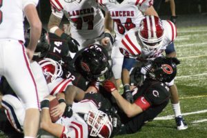 Kennedy runs into the Camas bulldozers Friday night, at Doc Harris Stadium. The Papermakers won 48-14 to return to the state quarterfinals.