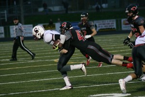 Camas High School junior linebacker Gabe Lopes lassos the Cascade quarterback Saturday, at Doc Harris Stadium. The Papermakers earned a 63-28 victory in their final home game of the season.