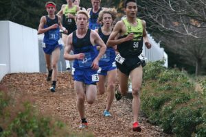 Said Guermali (56) lost his shoe somewhere on the Nike World Headquarters campus Sunday, but it didn't stop the Camas High School senior from crossing the finish line at BorderClash.