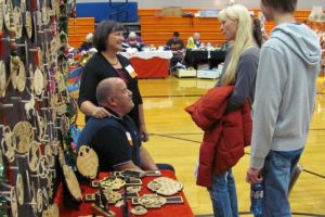 Larry and Cheryl Saari enjoyed participating in the Holiday Marketplace bazaar at Washougal High School, Nov. 15. They sold Christmas ornaments and other wood art that Larry created by hand with a scroll saw.