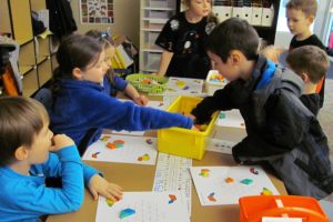 Students work on improving their math skills with hands-on activities. Grass Valley Elementary was selected as a statewide "School of Distinction" for achievement in reading and math.