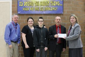 Umpqua Bank recently donated $2,000 to Jemtegaard Middle School through its "Give Back to School Fund." Pictured here are, left to right, Principal Ron Carlson, parent/nominator Jenny Dayley, student Cameron Dayley, special education teacher Lou Peterson and fund organizer Lori Wick.