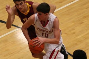 Tyler Hallead drives to the hoop for the Papermakers Friday, at Camas High School. The Falcons soared to a 62-56 overtime victory.