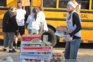 Washougal High School students spent their Friday afternoon collecting and loading food onto school buses during the annual Stuff the Bus event, which was created by the Camas-Washougal Business Alliance.