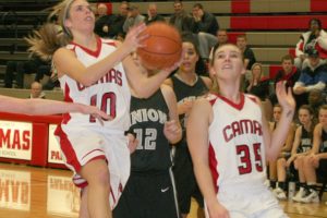 Sydney Allen glides to the hoop for two of her 15 points Wednesday, at Camas High School. The Papermakers defeated the Union Titans 52-38.