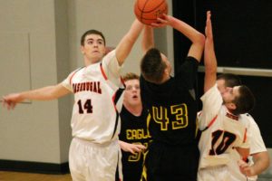 Ryan Taylor (14) and Daniel Davis contest a shot by Hudson's Bay Monday, at Washougal High School. The Panthers defeated the Eagles 53-26 for their seventh straight victory to start the year.