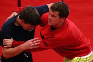 Camas High School seniors Tye Lommasson (left) and Marcus Hartman (right) tangle in the Papermaker wrestling room.